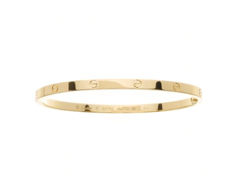Cartier, an 18ct gold Love bangle, with screw head motif highlights, signed Cartier, serial IUY702, Swiss convention marks, C