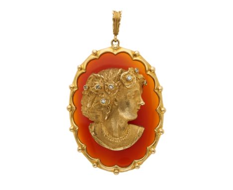 A 9ct gold single-cut diamond accent portrait pendant, atop an oval carnelian cabochon panel, with bead surround and tapered 