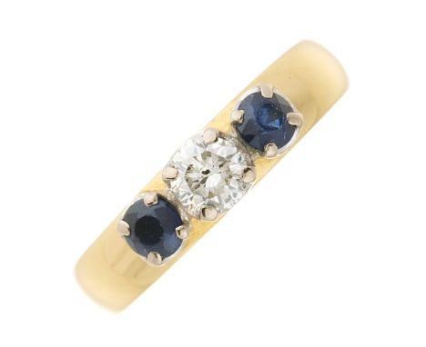 An 18ct gold brilliant-cut diamond and circular-shape sapphire three-stone band ring, diamond estimated weight 0.30ct, J-K co