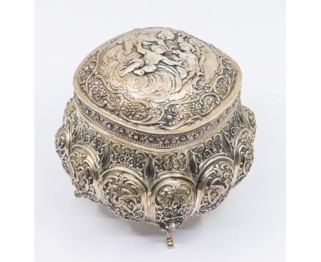 A Continental probably German 800 standard silver large tea caddy, the hinged cover chased with cherubs, the body with raised