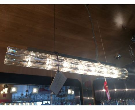 A genuine Swarovski tubular crystal pendant with seven G9 bulbs within the tube, the hexagonal tube consists of Swarovski pri