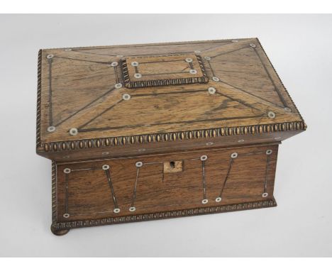 Large 19th century mahogany sarcophagus tea caddy with two tea compartments on either side of a glass mixing bowl. It is inla