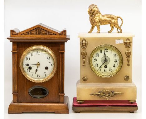 A French Alabaster style mantel clock with gilded lion on top, single train movement with 4" white dial Arabic numerals case 