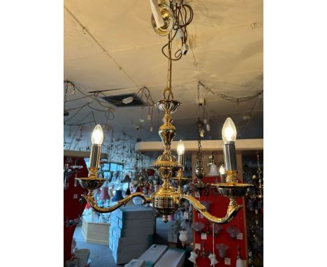 A three-arm pewter and gold-plated finish chandelier of solid brass construction with pewter detailing on the sconces and cen
