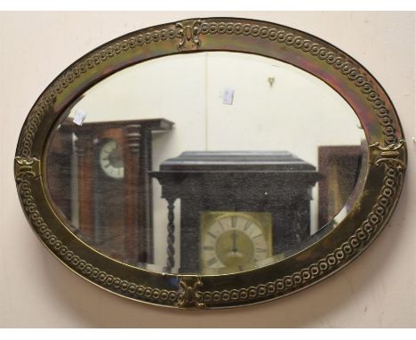Two early 20th Century oval wall mirrors, along with 1940's fireguard, one with copper frame