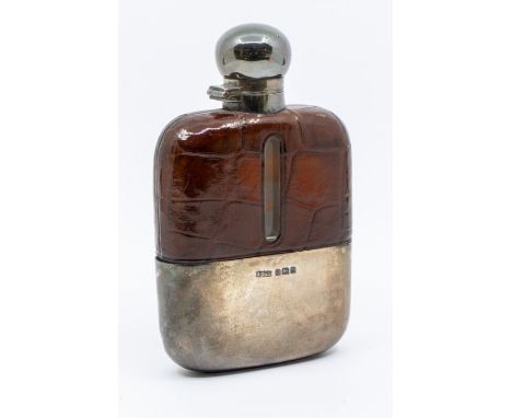 An Edwardian hip flask with a silver top/cap, and detachable flask with a leather surround, hallmarked for Sheffield 1906 by 