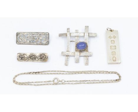 An assorted collection of silver jewellery to include: a modernist, hand-made, unmarked, 'gate-like' designed, blue stone bro