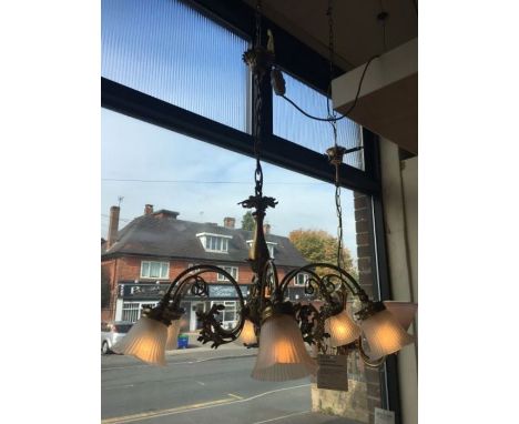 A French style six arm antique gold brass chandelier, complete with six acid glass shades, scrolled leaf design inside arms, 