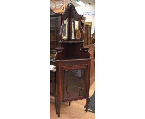 Slender Victorian mahogany corner cupboard with two mirrored panels to top sitting on top shelf above bottom glazed doors wit