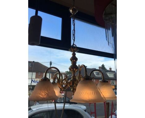 A good quality five-arm downward facing gold and solid brass chandelier, complete with white marble effect glass shades, 5 x 