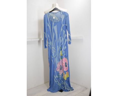 A silk Jersey 1970s dress with a black background and short fan sleeves edged in jade and a pink floral design - the design o