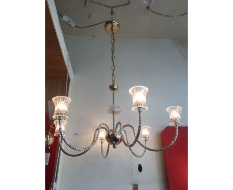 A six light 24ct gold-plated chandelier with clear ribbed glass shades, the six arms and central column are of diamante style