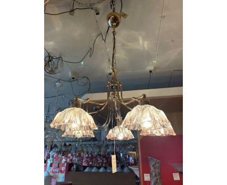 A five-arm gold finish and silver chandelier, complete with clear and pink ribbed glass shades, height adjustable gold finish