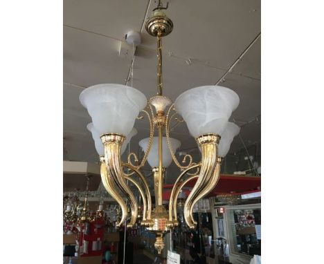 A five light solid brass 24ct gold plated chandelier, each ribbed torchiere style arm has a thick white Alabaster glass shade