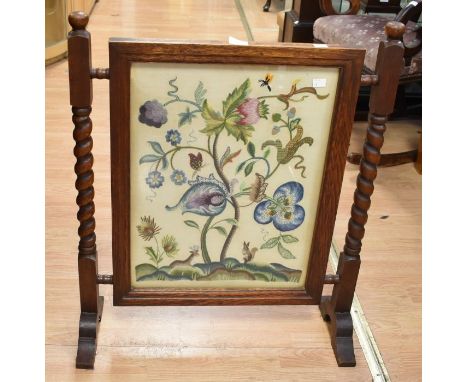 Tapestry fire screen, contained in an oak frame with turned barley twist legs. Tapestry is still very colourful showing flowe
