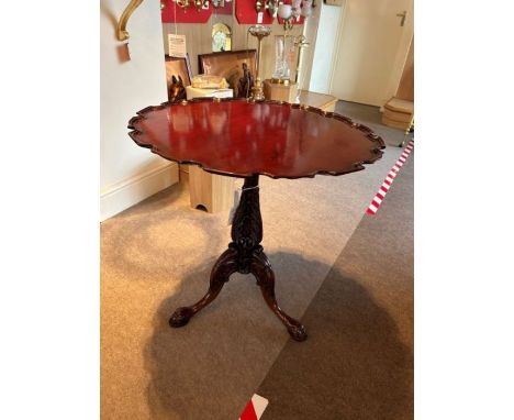 A walnut tilt top French table, consists of a frilly outer edge top and three carved legs, diameter 70cm, height 72cm.  RRP £