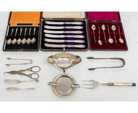 A collection of silver to include; a pair of sugar tongs hallmarked for Newcastle 1824 by John Walton, a two handled loving c