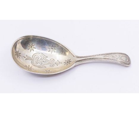 A Victorian silver caddy spoon with engraved design and a vacant cartouche, hallmarked by George Adams (Chawner &amp; Co.)., 