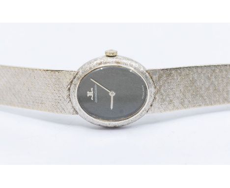 Jaeger LeCoultre- a ladies 18ct white gold wristwatch, comprising a signed black oval dial, width approx 22mm, cased back mar