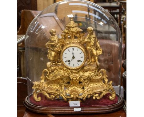 A French Spelter gilded mantel clock under glass dome, with 2 train 8 day French movement, striking on a bell, with 3"  dial 