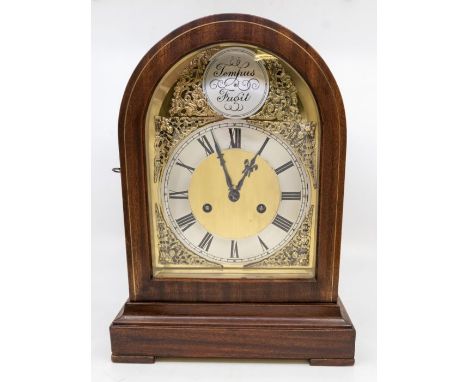 A round top mantel clock with 2 train 7" brass arch dial, with mask spindles. Two train spring driven Gustav Beaker movement,