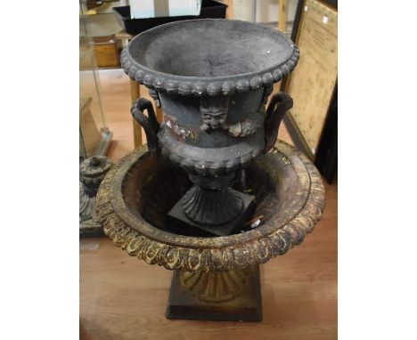 A pair of early 20th Century cast planters fashioned as Campagna urns, height 35cm, diameter 52cm, along with a further decor