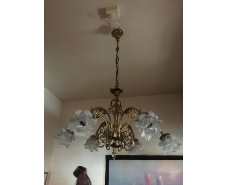 A French style six arm antique gold brass chandelier, complete with six French petal acid glass shades, scrolled leaf design 
