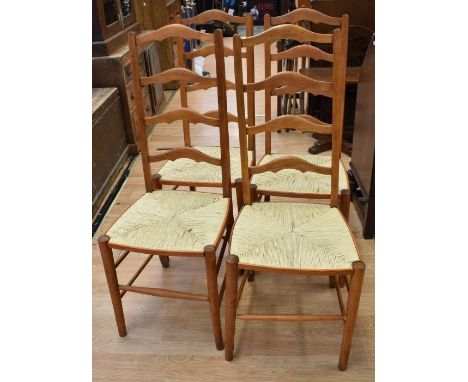 Four pine ladder backed dining chairs and folding seat