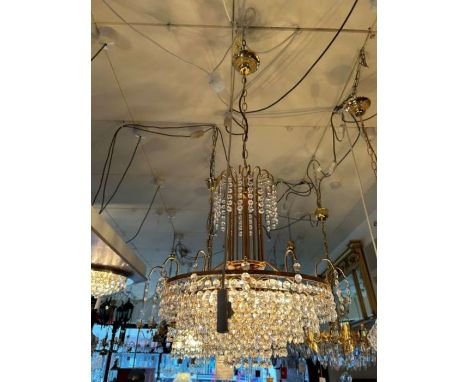 A six light Strass crystal and gold finish chandelier, the frame consists of a fountain on the central column and individual 
