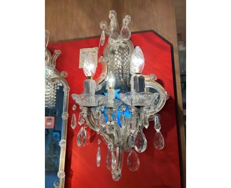 A set of four mirror lights to include; one small, two medium and one large.The small mirror has a curved mirrored back and t