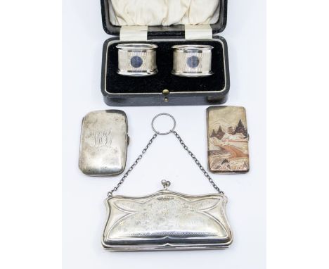 A collection of silver to include:&nbsp;&nbsp;a pair of George V boxed engine turned napkin rings, hallmarked C T Burrows, Bi