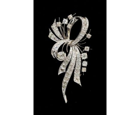 A diamond and 18ct white gold spray brooch, comprising claw set round brilliant cut accents to grain set diamond bow like row