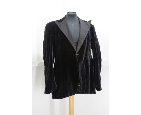 A men’s velvet smokers’ jacket with wide lapels in a complimentary sateen fabric. It is fully lined. Size 42-44” chest.A Chri