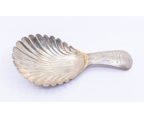 A Georgian silver shell shaped caddy spoon, engraved decoration the handle, vacant cartouche, hallmarked by Joseph Taylor, Bi
