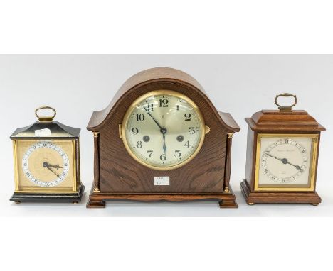 A Gustav Becker mantel clock with 2 train movement chiming on a gong, contained in a round top oak case with brass Pendulum &