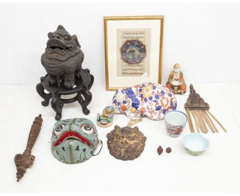 A collection of Oriental items to include: a Chinese stoneware mask depicting a Foo dog, with character marks around back rim