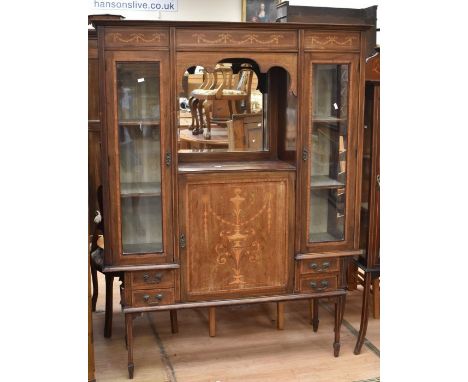 An Edwardian part-glazed display cabinet with Adam style inlay, glazed sides flanking open mirrored shelf, above cupboard doo