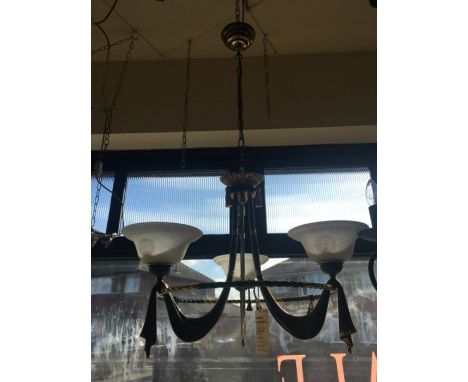 A three light verdigris and solid brass chandelier, consists of three draped arms which meet a circular frame and finished wi