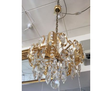 A five light gold-plated and crystal prism chandelier, consists of oval hoops and crystal droplets throughout, a gold-plated 