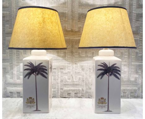 INDIA JANE TABLE LAMPS, a pair, ceramic with palm tree and armorial decoration with Pooky shades, 53cm H. (2)