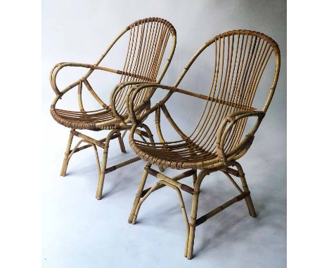 RATTAN ARMCHAIRS, a pair, 1970's 'spoon shaped' woven rattan each with embroidered cushion, 61cm W. (2)