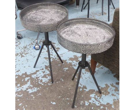 SIDE TABLES, a pair, vintage style worked metal tops, 34cm diam. x 61cm H. (2)