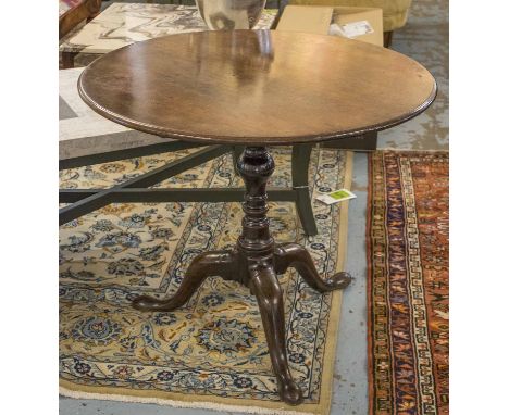 TRIPOD TABLE, George III mahogany with a circular top and bird cage action on a turned pedestal column with swept slipper fee
