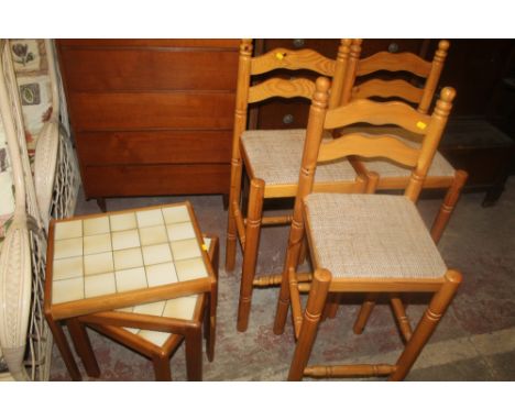 A TILE TOP NEST OF TABLES, TOGETHER WITH THREE HONEY PINE CHAIRS