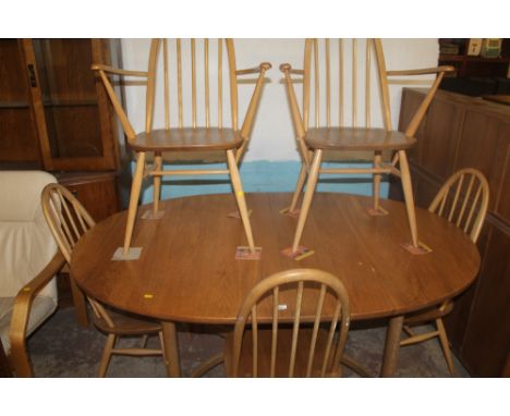 A DINING ROOM TABLE TOGETHER WITH FIVE ERCOL CHAIRS