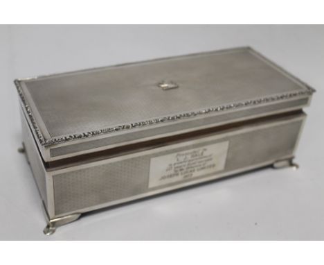 A HALLMARKED SILVER TABLE CIGARETTE CASKET, WITH 'JOSEPH LUCAS LTD' INSCRIPTION