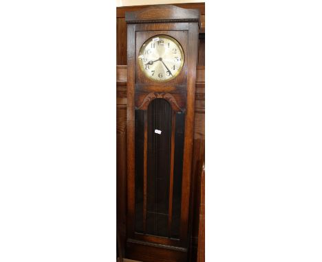A 1920's oak long case clock