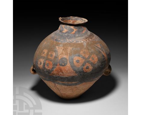 3rd millennium B.C. A carinated ceramic jar with short everted neck and two loop handles low down on the body, the upper body