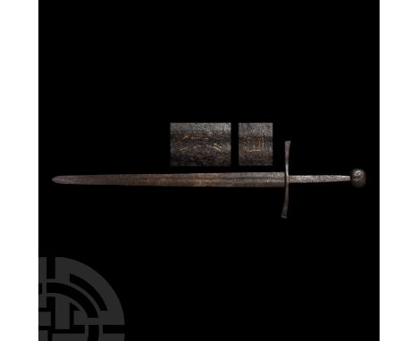 14th-15th century A.D. An iron long sword of Oakeshott's miscellaneous type, cross style 5, pommel style H1, with a long tape