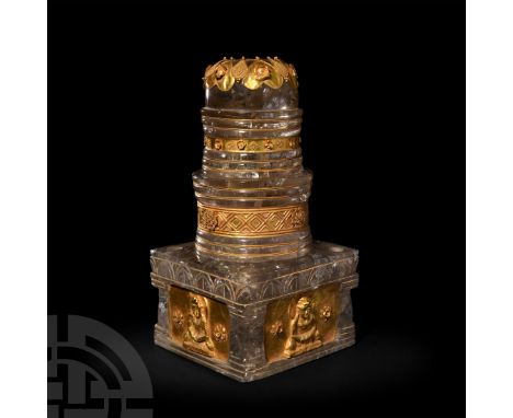 19th century A.D. or earlier. A carved rock crystal tiered model stupa with sheet gold fittings; the crystal segments with ci